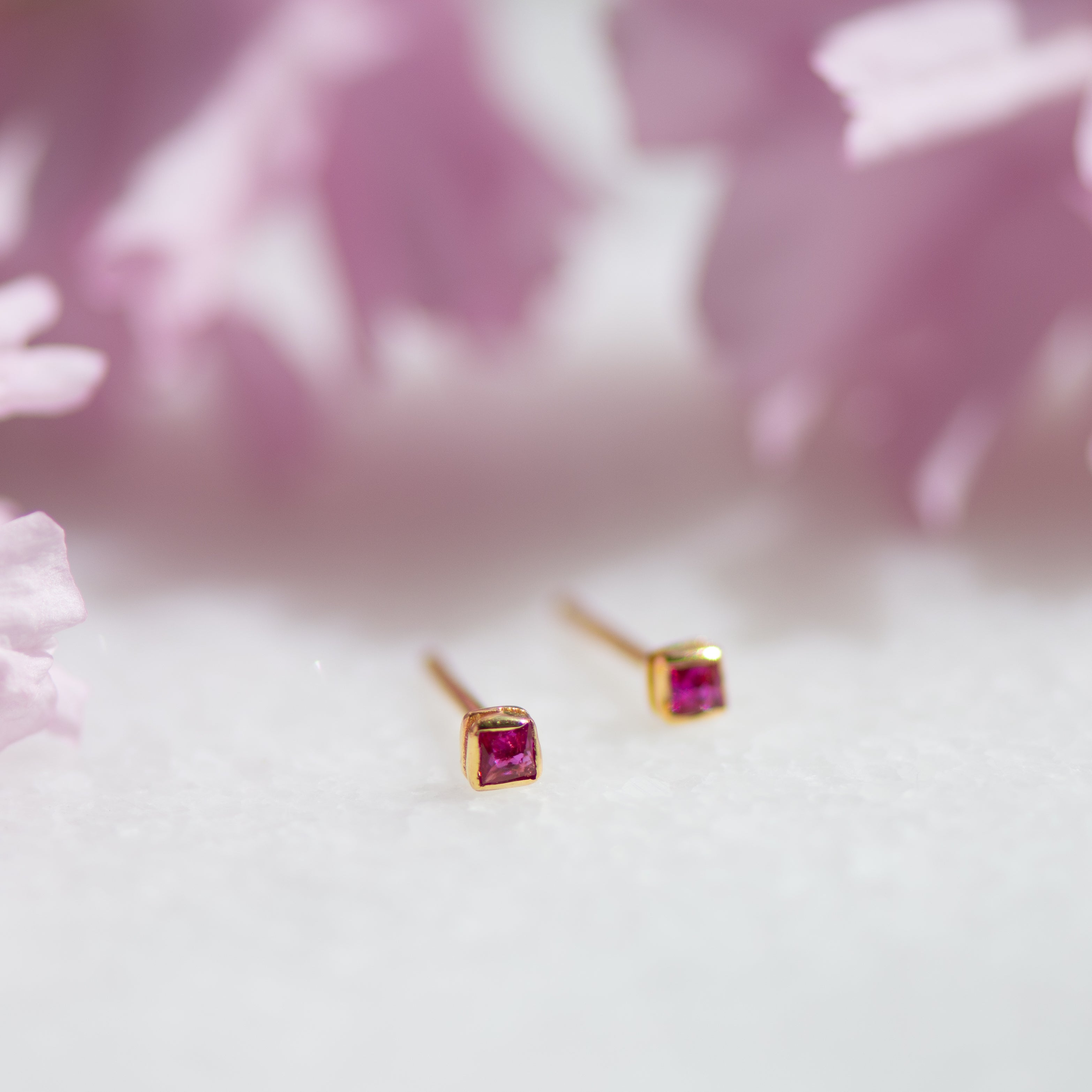 ruby zirconia square gold ear studs from memara