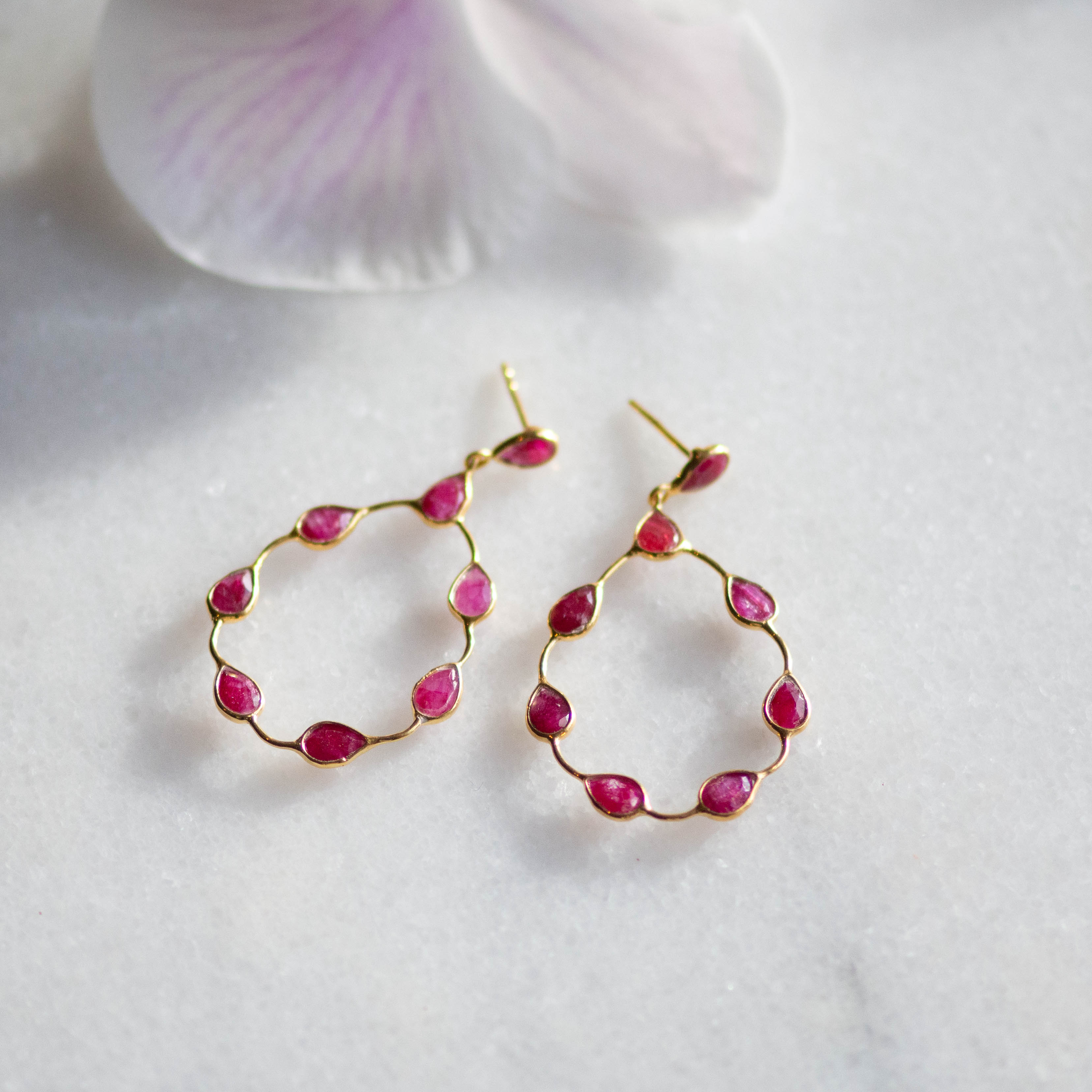 Tikka in Gold with pear shaped ruby droplets. Earring Memara