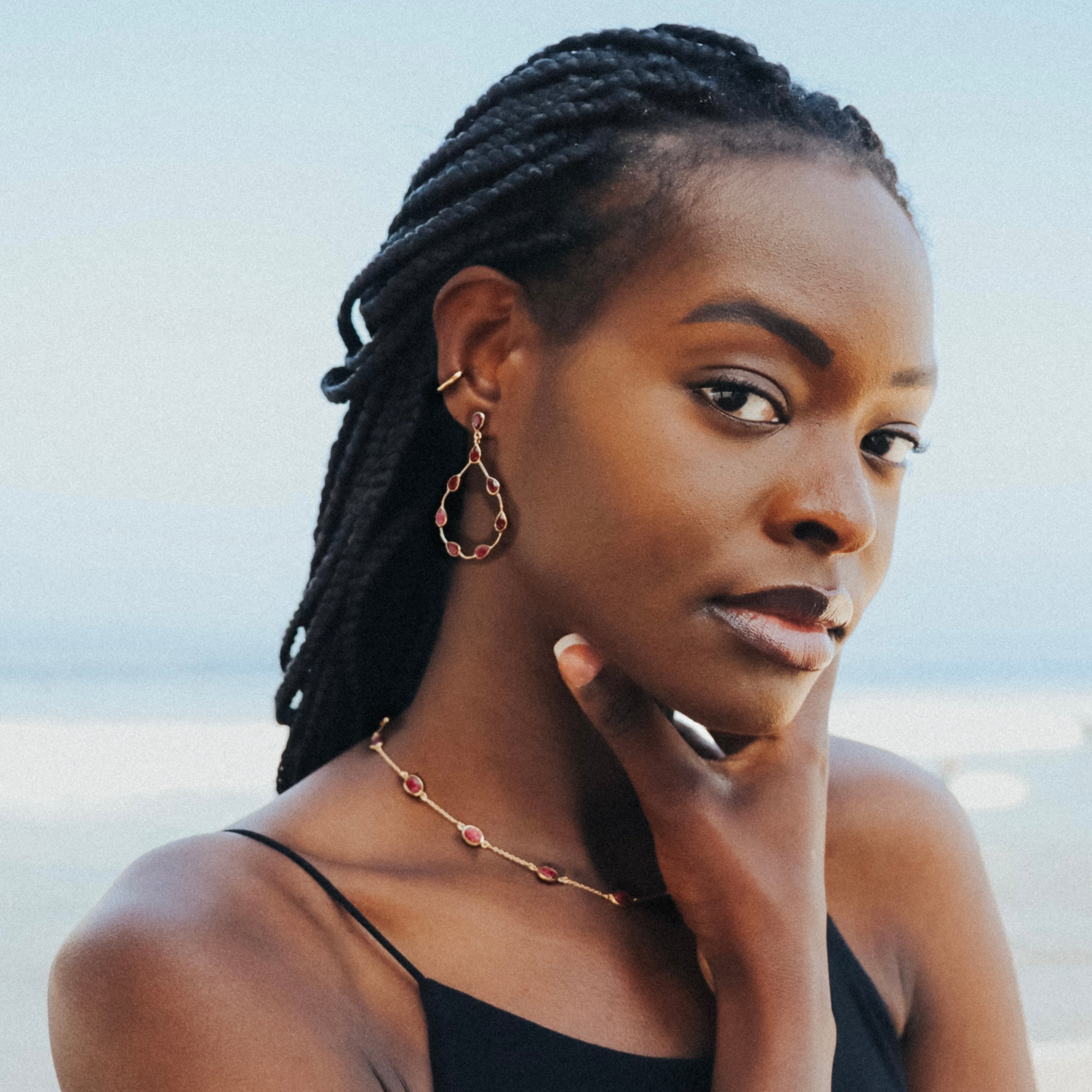 Tikka in Gold with pear shaped ruby droplets. Earring Memara