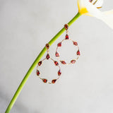 Tikka in Gold with pear shaped Garnet droplets