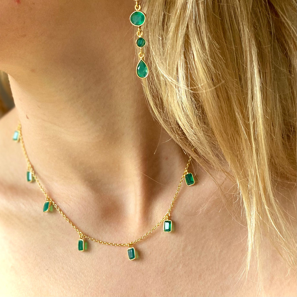 Model wearing the Tiggy Necklace in Gold and Green Onyx with matching earrings