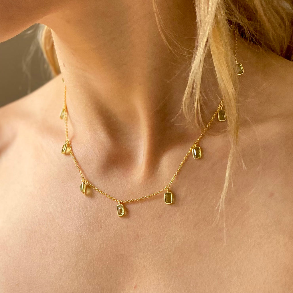 Model wearing the  Tiggy Necklace in Gold and Peridot